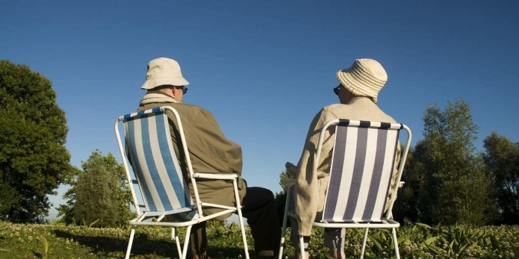 two people sitting on the sun